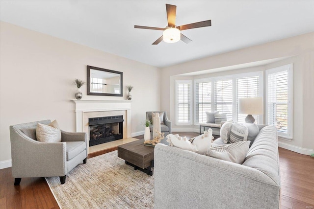 living room featuring plenty of natural light, hardwood / wood-style floors, and ceiling fan