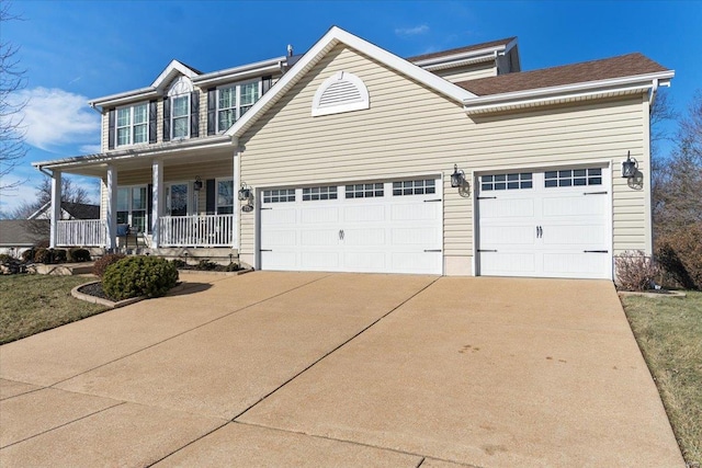 view of front of house featuring a porch and a garage