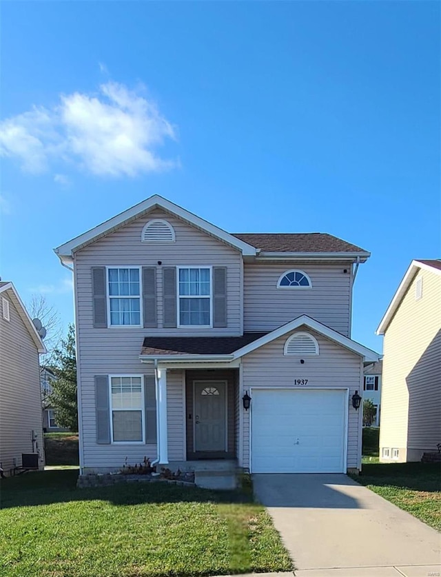 front of property with a garage and a front yard