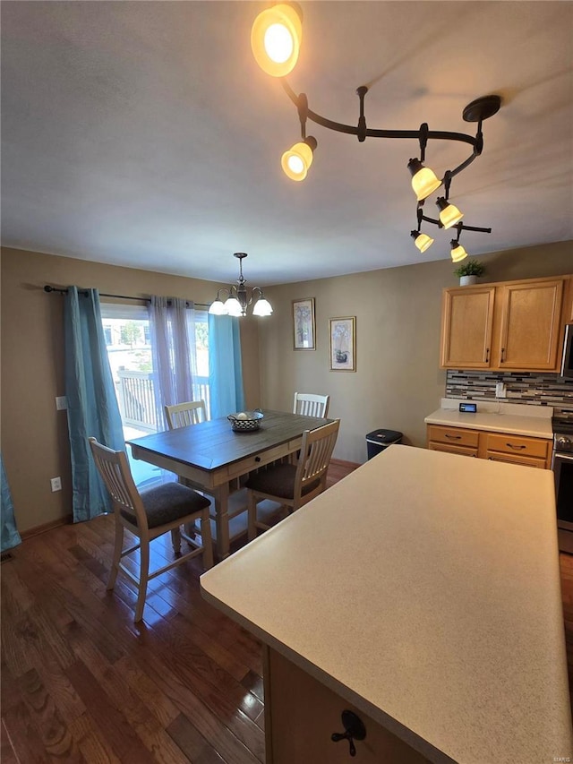 unfurnished dining area featuring dark wood-type flooring and a chandelier