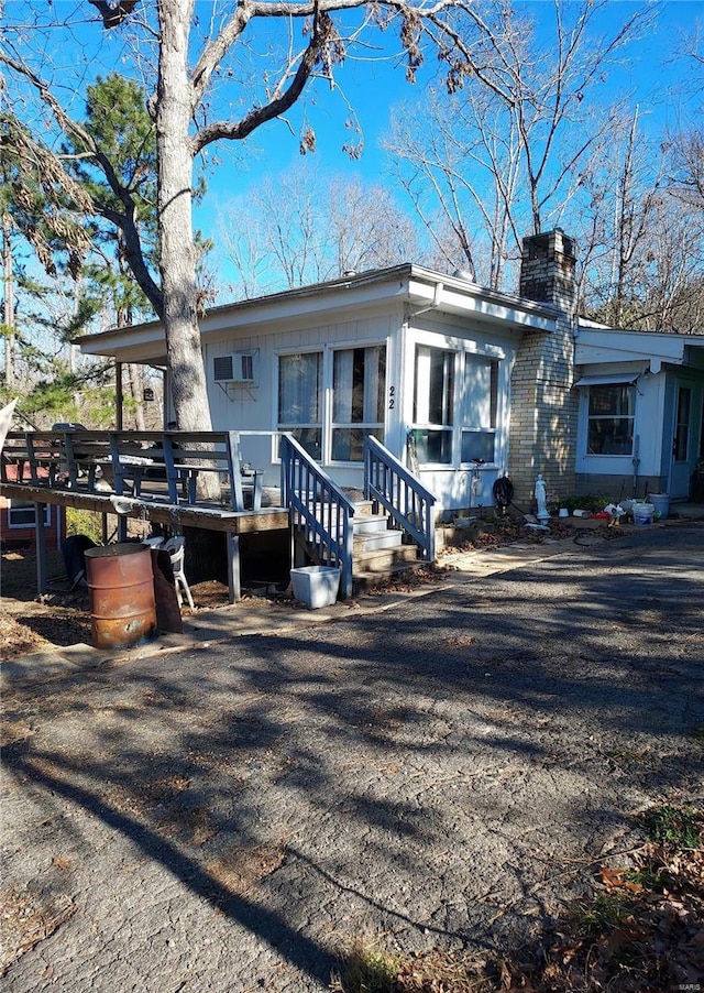 view of front of home with a wooden deck