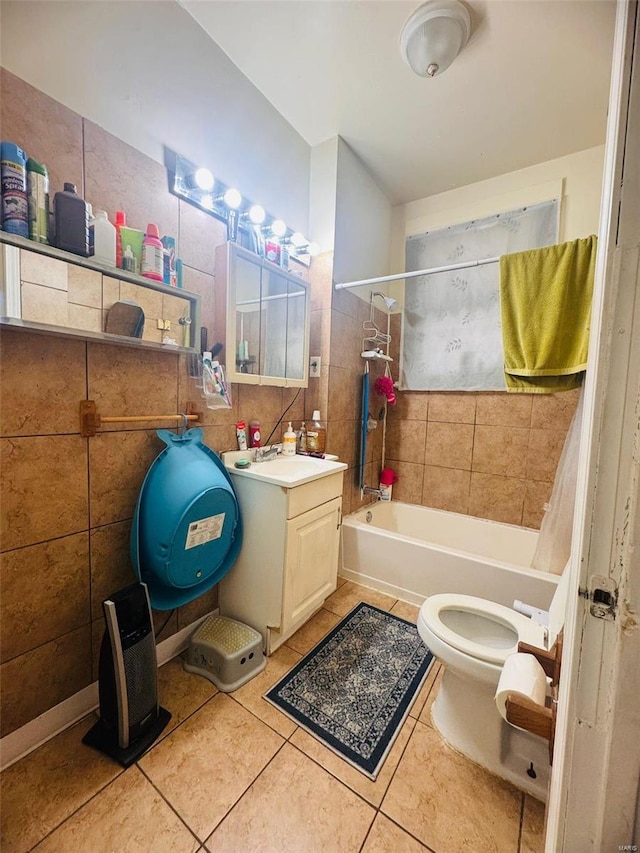 full bathroom featuring tile patterned flooring, vanity, tile walls, and shower / tub combo with curtain