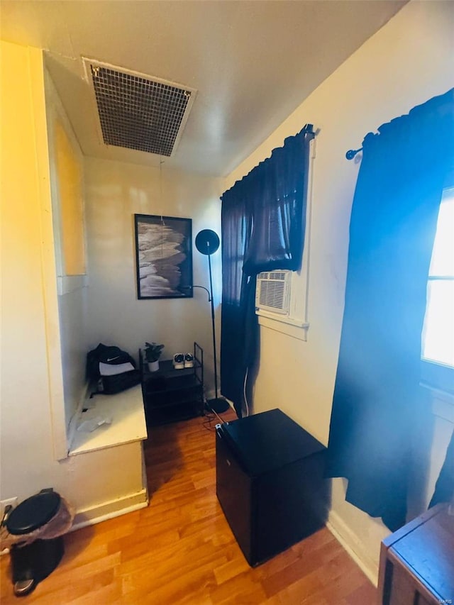 home office featuring cooling unit and wood-type flooring