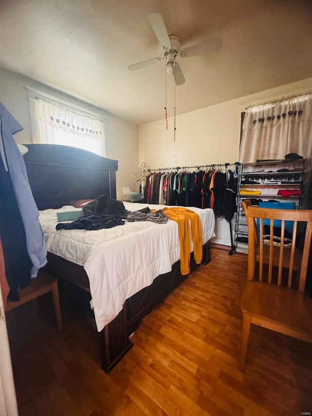 bedroom featuring ceiling fan and hardwood / wood-style flooring