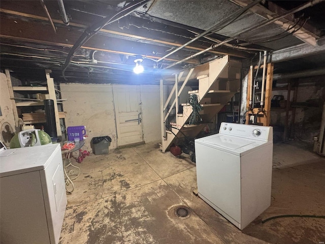 basement featuring washing machine and clothes dryer