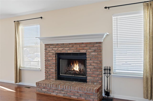 room details featuring hardwood / wood-style floors and a fireplace