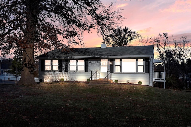 ranch-style house with a yard