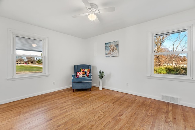 unfurnished room featuring ceiling fan and light wood-type flooring