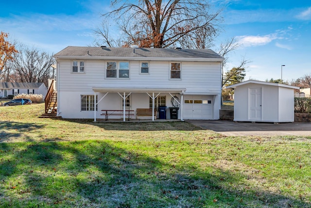 back of property featuring a lawn, a patio area, a storage shed, and a garage