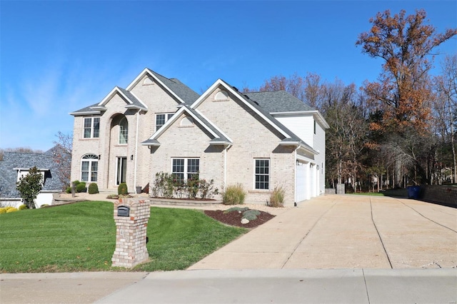 view of front of home featuring a garage and a front lawn