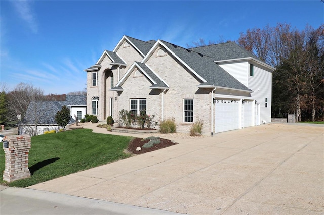 view of front of house with a garage and a front yard