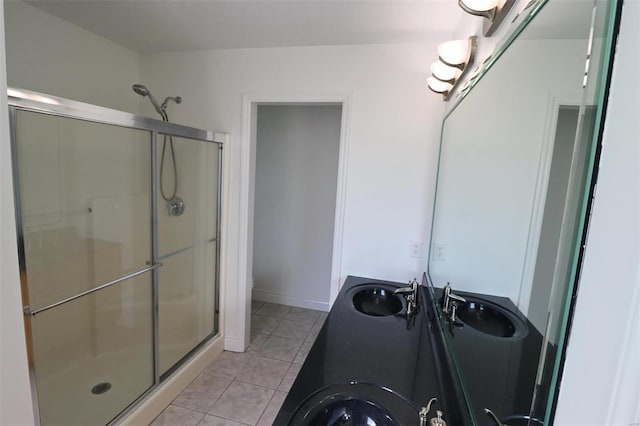 bathroom with tile patterned floors, vanity, toilet, and walk in shower