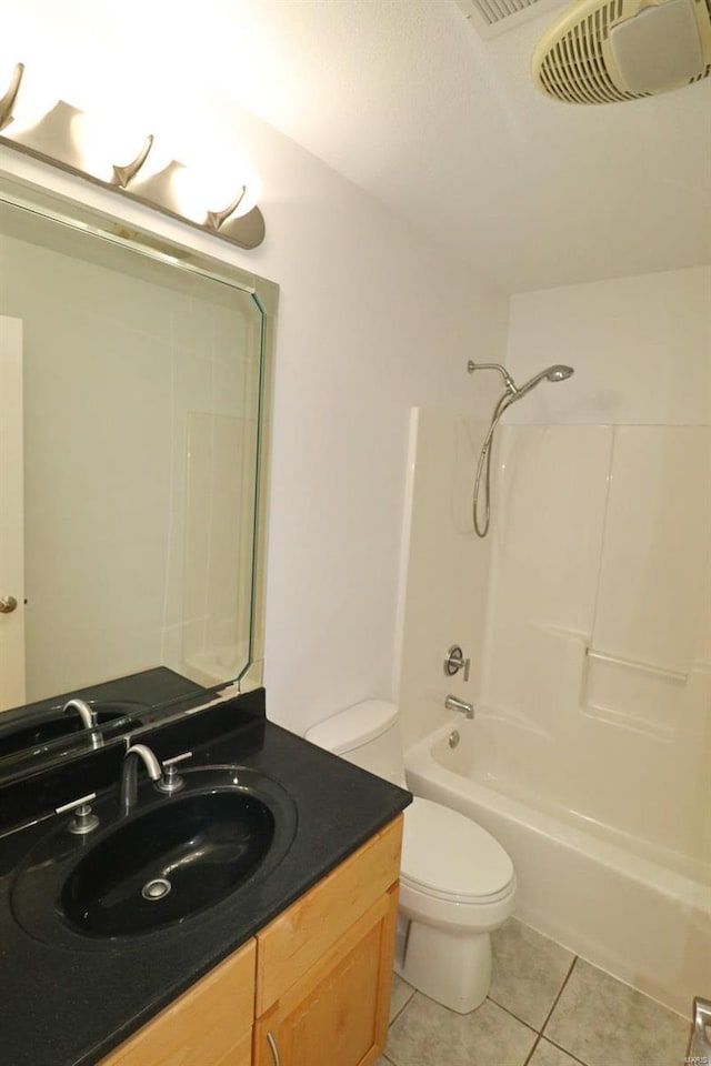 full bathroom featuring tile patterned flooring, vanity,  shower combination, and toilet