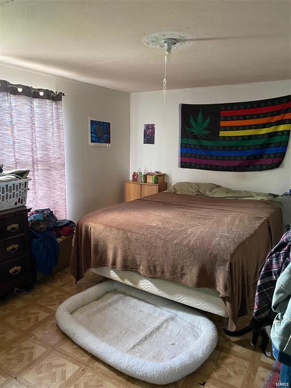 bedroom with parquet floors