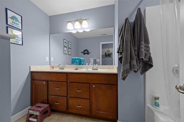 bathroom featuring shower / bathing tub combination and vanity