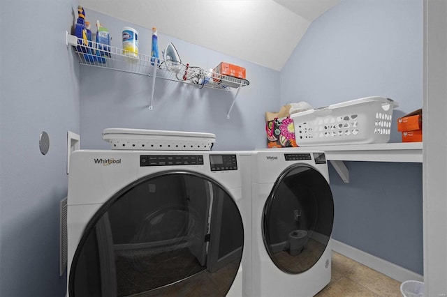 washroom featuring independent washer and dryer and light tile patterned flooring