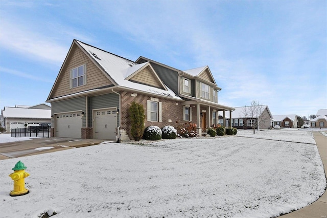 view of property featuring covered porch and a garage