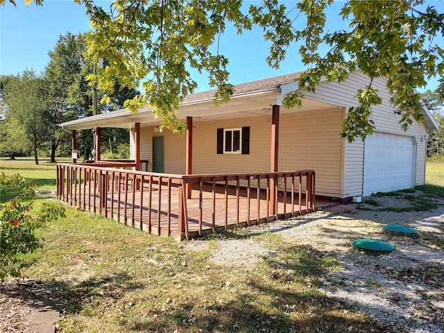 view of property exterior featuring a porch and a garage