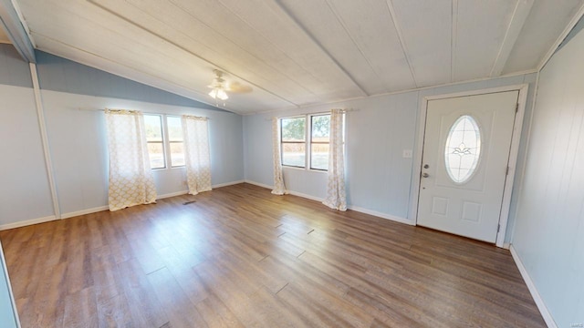 entryway with hardwood / wood-style flooring, ceiling fan, and lofted ceiling