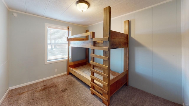 carpeted bedroom featuring a textured ceiling and crown molding