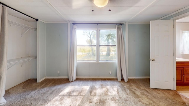 unfurnished bedroom with light carpet