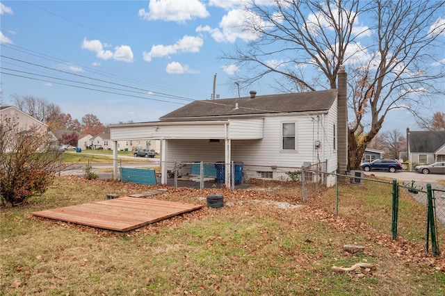 back of house with a yard and a wooden deck