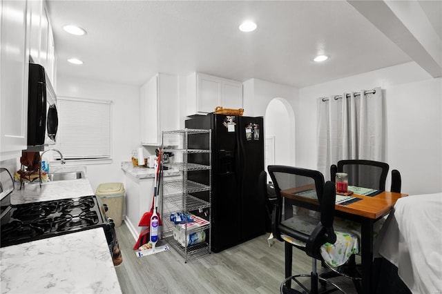 office space with sink and light hardwood / wood-style flooring