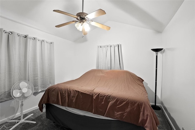 carpeted bedroom with ceiling fan and lofted ceiling