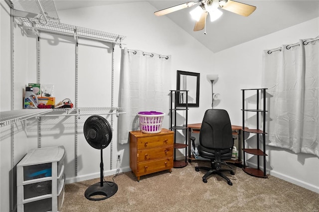 carpeted office space with ceiling fan and lofted ceiling