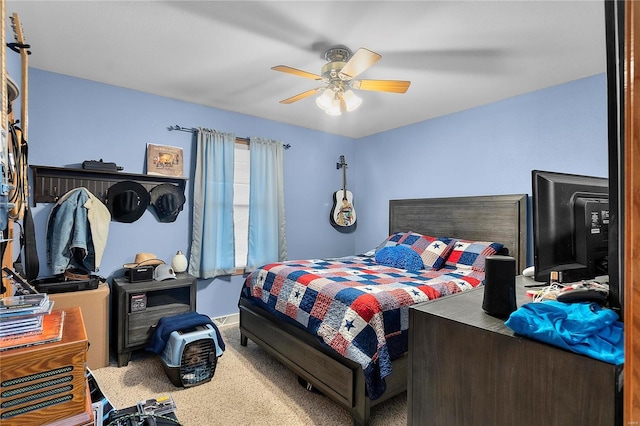 bedroom featuring ceiling fan, baseboards, and carpet