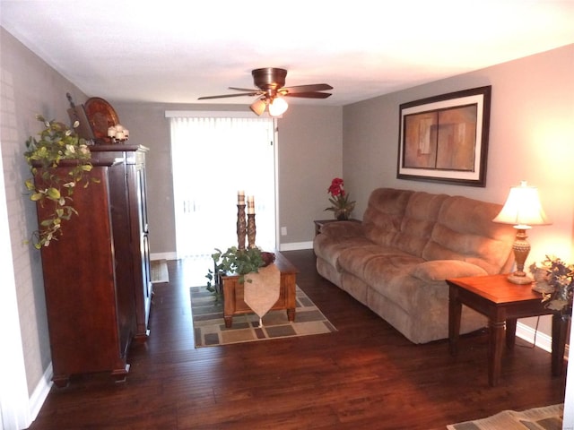 living room with dark hardwood / wood-style floors and ceiling fan