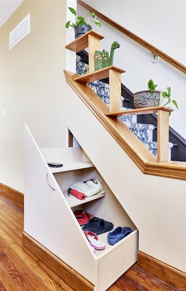 staircase featuring hardwood / wood-style floors