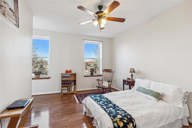 bedroom featuring ceiling fan and dark wood-type flooring