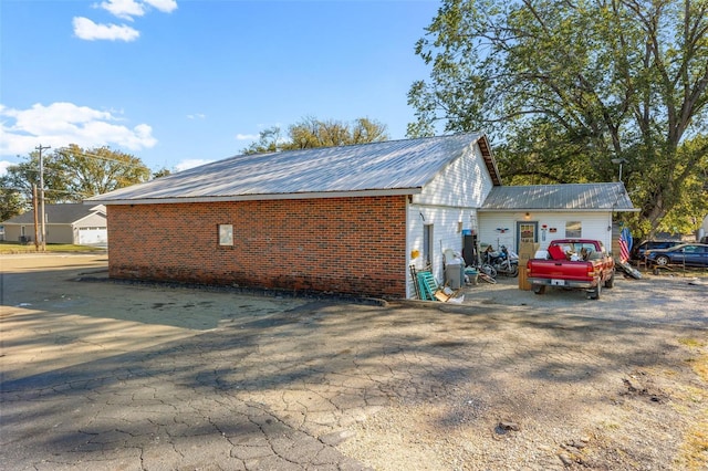 view of home's exterior featuring metal roof
