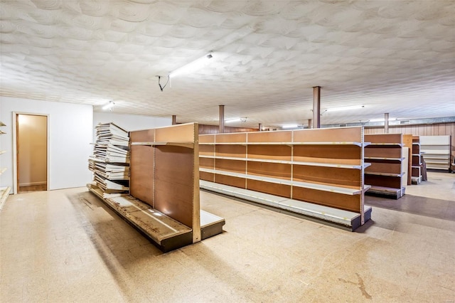 basement featuring a textured ceiling