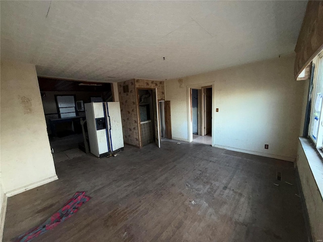 unfurnished living room featuring dark hardwood / wood-style floors