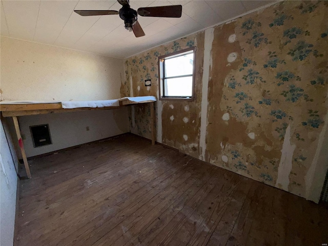 spare room featuring hardwood / wood-style flooring and ceiling fan