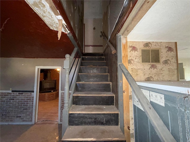 stairway featuring concrete floors