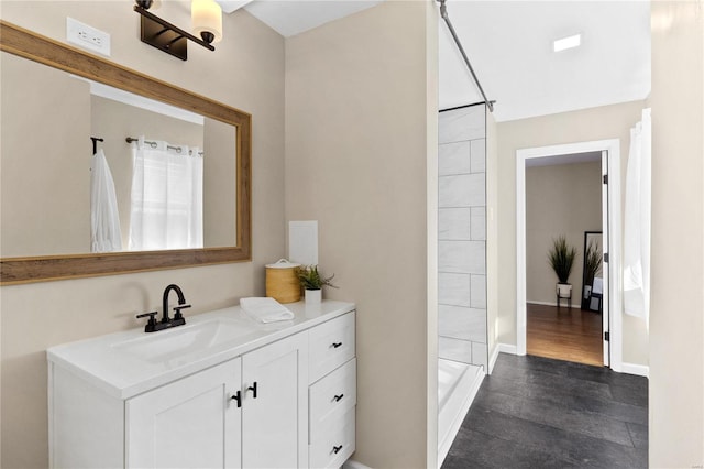 bathroom featuring vanity, wood-type flooring, and walk in shower