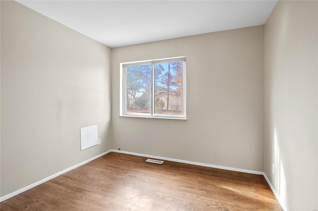 empty room featuring hardwood / wood-style flooring