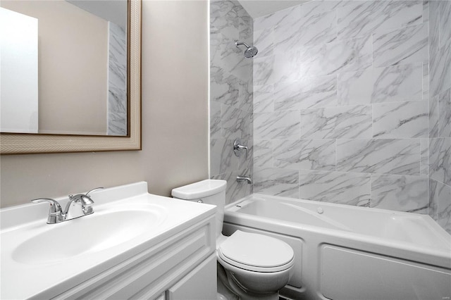 full bathroom with vanity, toilet, and tiled shower / bath