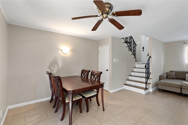 dining room featuring light tile patterned floors and ceiling fan