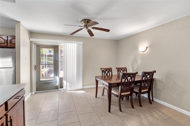 dining room featuring ceiling fan and light tile patterned flooring