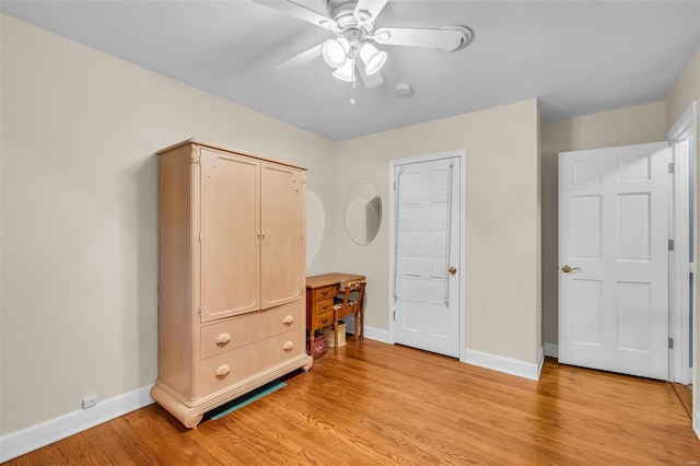 bedroom with ceiling fan and light hardwood / wood-style floors