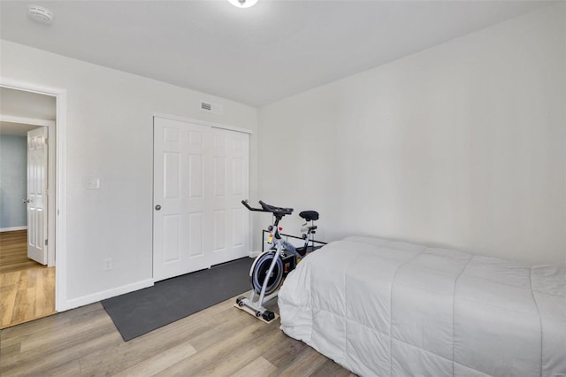 bedroom featuring a closet and hardwood / wood-style flooring