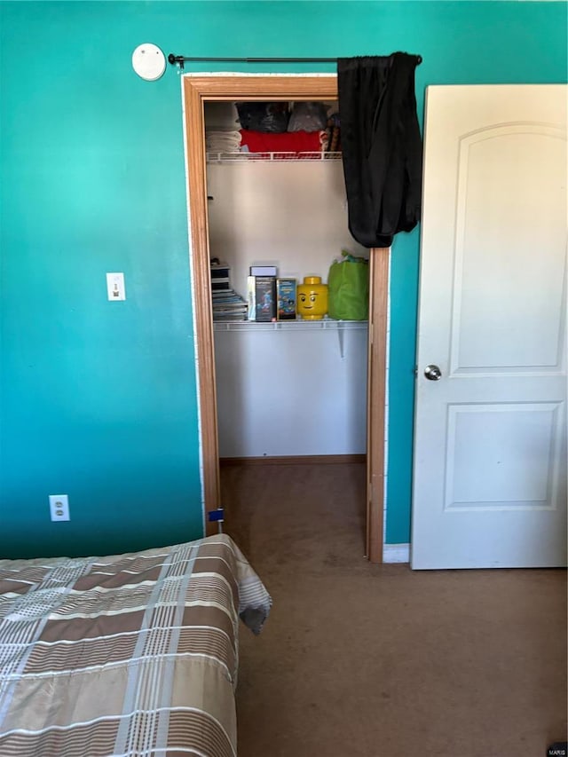 unfurnished bedroom with a closet and carpet