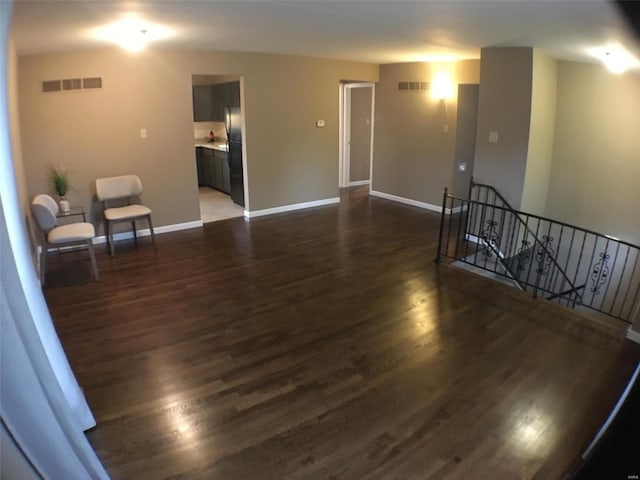 spare room featuring dark wood-type flooring