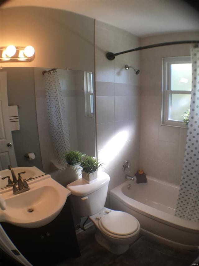 full bathroom featuring vanity, toilet, and shower / bath combo with shower curtain