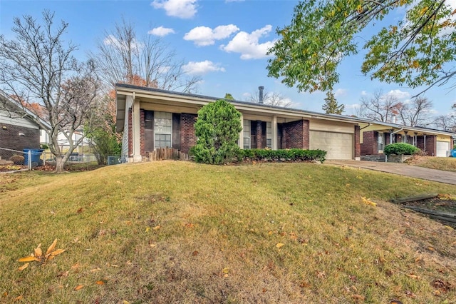 ranch-style house with a front lawn and a garage