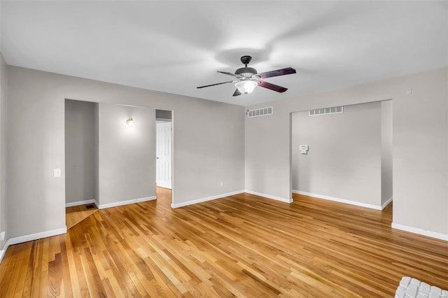 unfurnished room with light wood-type flooring and ceiling fan